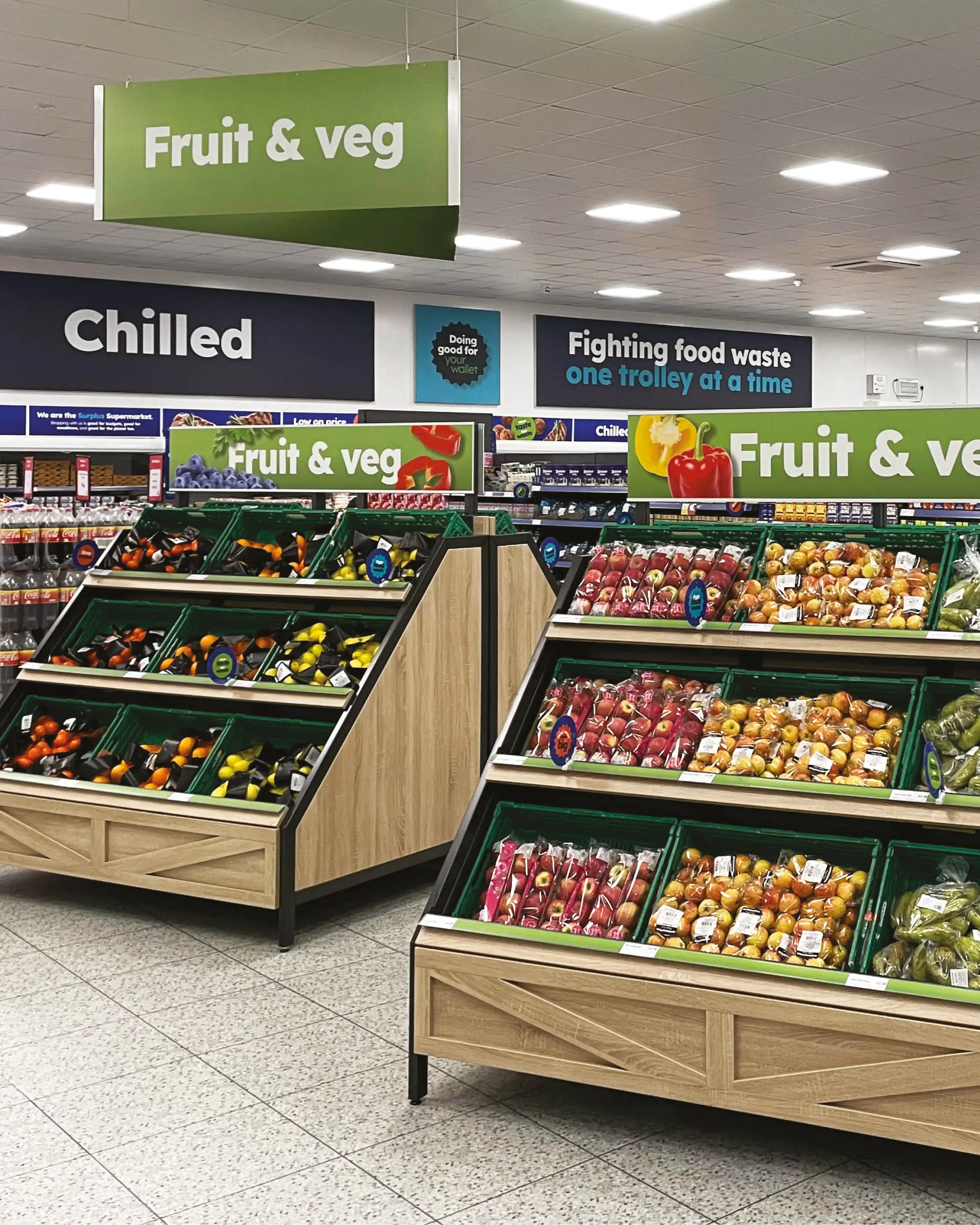 Fresh fruit and veg stalls at Company Shop stocked with surplus oranges, lemons, apples and pears.