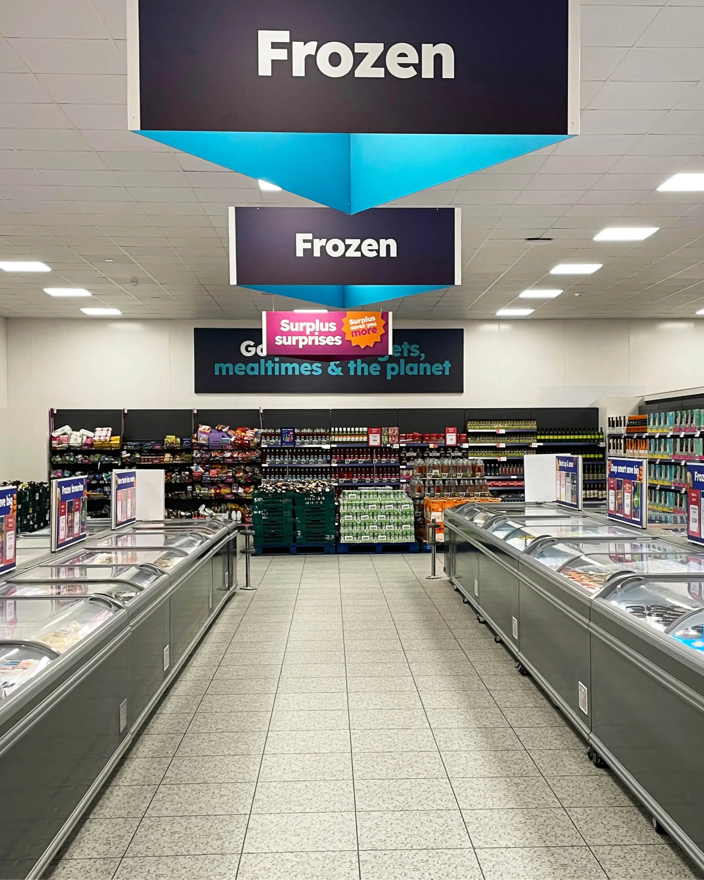 The frozen aisle in Company Shop is well-stocked surplus frozen produce.