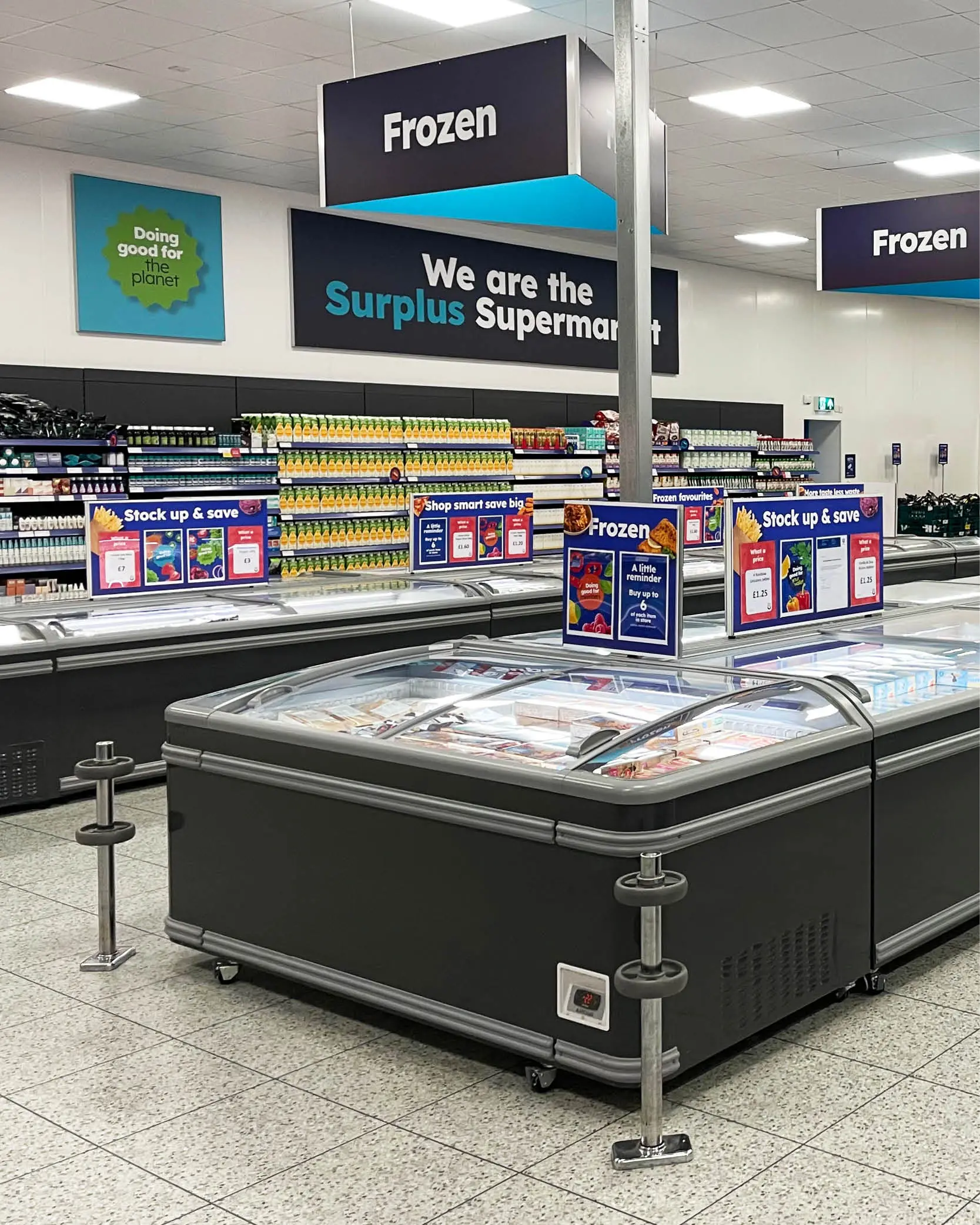 Frozen section of Company Shop surplus supermarket with fully stocked freezers.