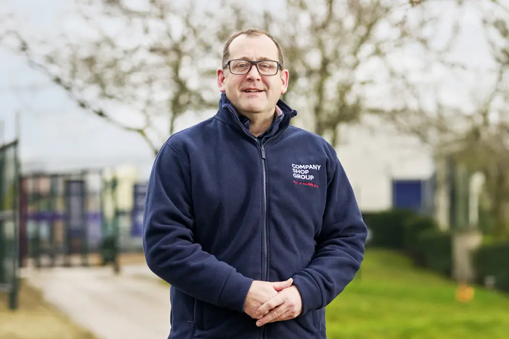 Chris Burns, MD of Company Shop Group, wearing a branded fleece outside the Wentworth head office.