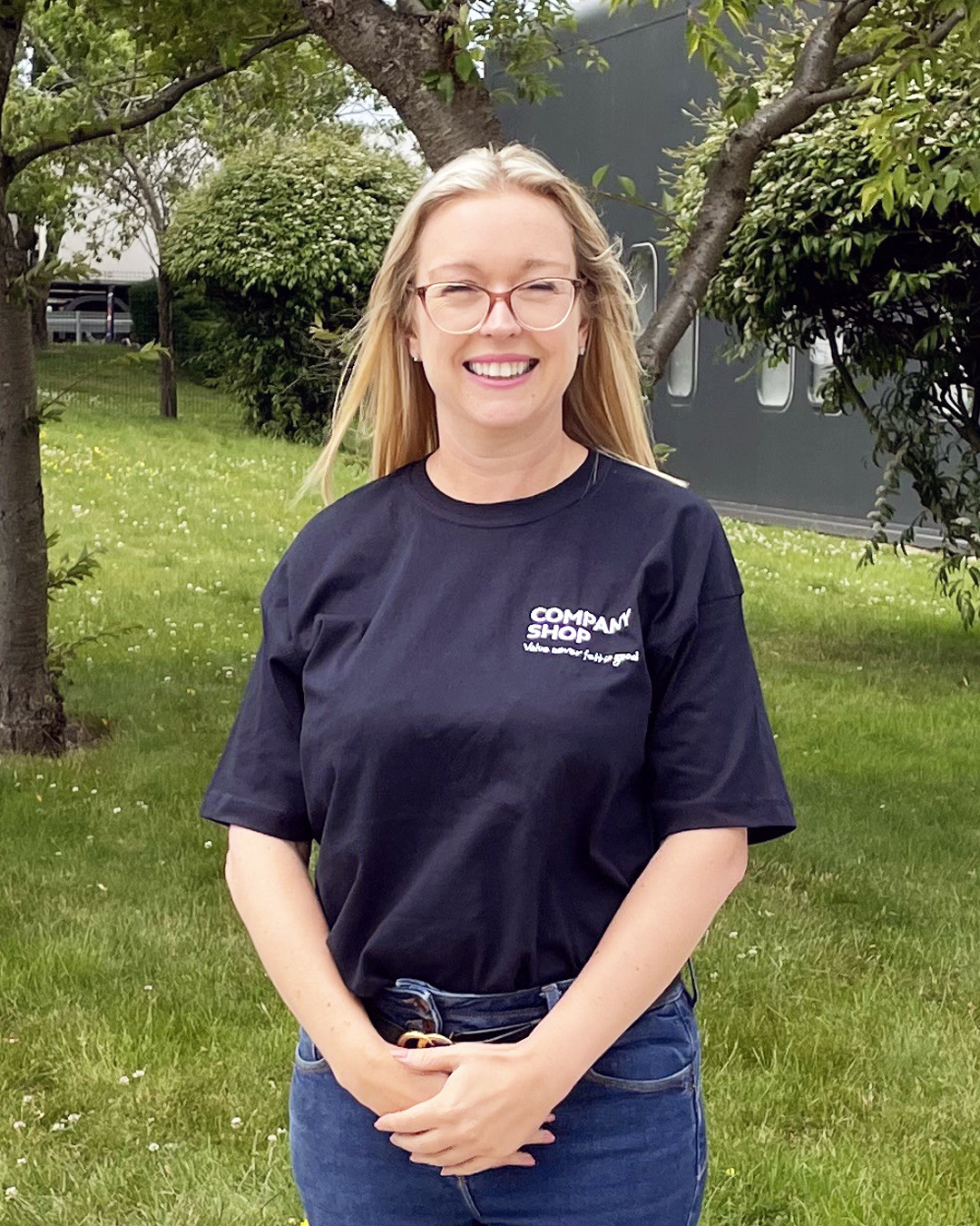 Holly Mobley, Commercial Director at Company Shop Group, stands outside in the sunshine.